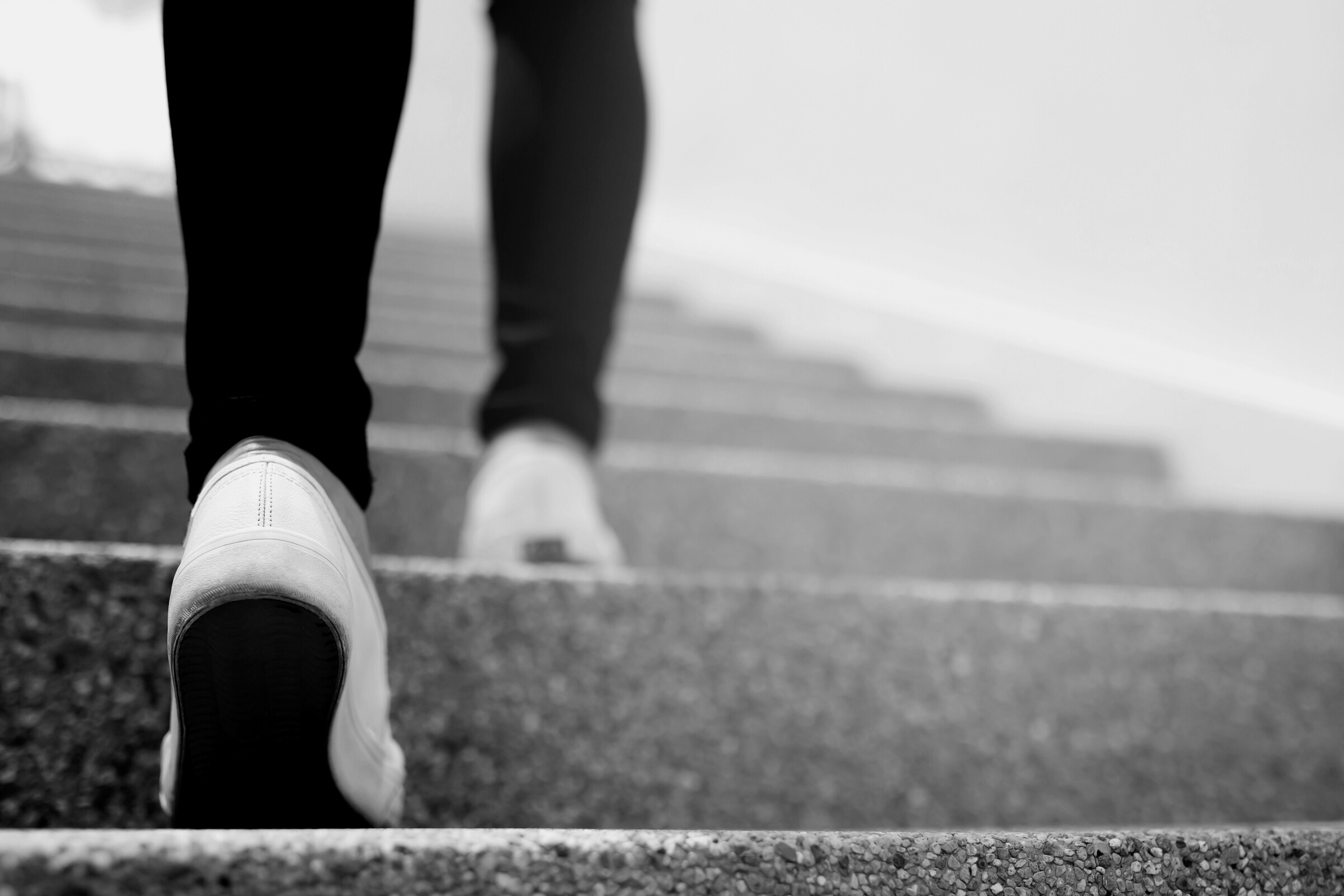 Woman Walking Up the Stairs